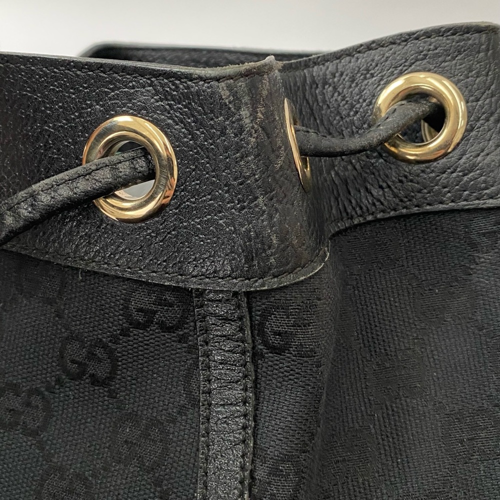 Gucci Black GG Canvas Drawstring Backpack with Gold Accent - Picture 4 of 14
